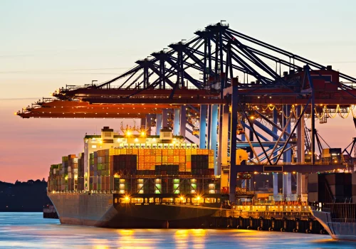 Container ship at a terminal at dusk