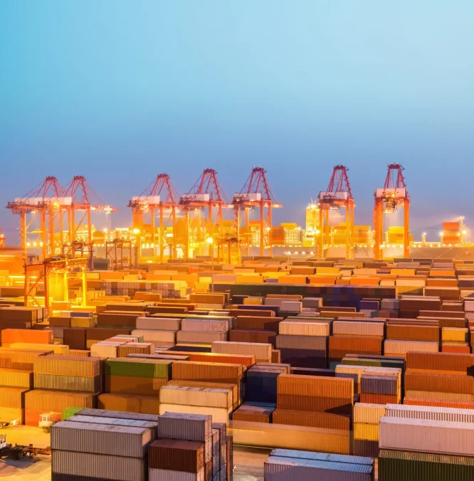 shanghai container port in nightfall, international import and export trade background